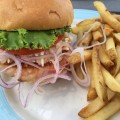 Shrimp Burger with Natural, jumbo-sized tail off shrimp shaped into an irresistible patty and grilled to perfection. Topped with our own remoulade slaw
