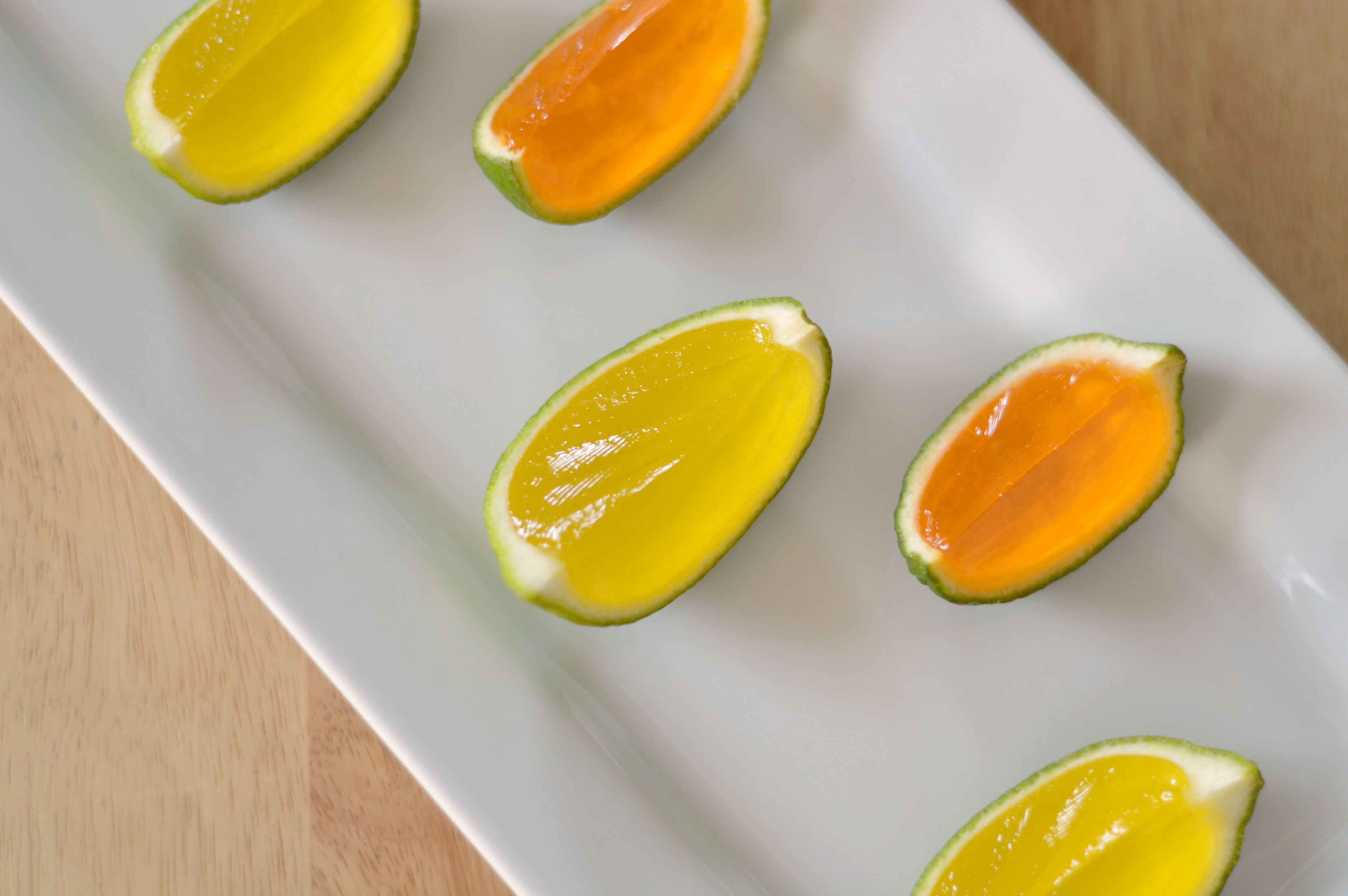 Lemon Lime and Mango Jell-O Shots in Lime Peels