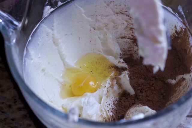 cheesecake recipe batter with egg and cocoa powder