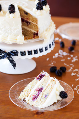 The PKP Way | A cake for all occasions, this Blackberry Coconut Cake has a dense and moist crumb of blackberries and coconut, is filled with rich coconut buttercream, and frosted with tangy cream cheese frosting. Perfect for berry and coconut lovers everywhere.