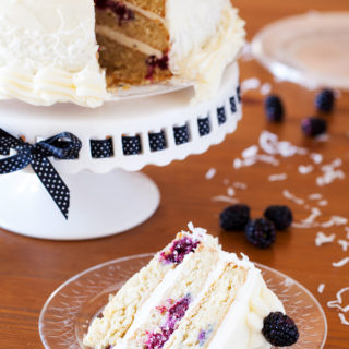 The PKP Way | A cake for all occasions, this Blackberry Coconut Cake has a dense and moist crumb of blackberries and coconut, is filled with rich coconut buttercream, and frosted with tangy cream cheese frosting. Perfect for berry and coconut lovers everywhere.