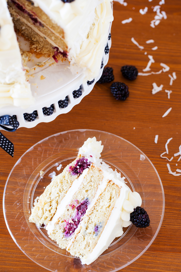 The PKP Way | A cake for all occasions, this Blackberry Coconut Cake has a dense and moist crumb of blackberries and coconut, is filled with rich coconut buttercream, and frosted with tangy cream cheese frosting. Perfect for berry and coconut lovers everywhere. 