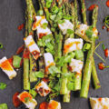 This grilled asparagus and halloumi salad is topped with spicy harissa vinaigrette, and is the perfect Spring/Summertime grilling recipe! Seasonal, fresh, and ready in only 15 minutes!