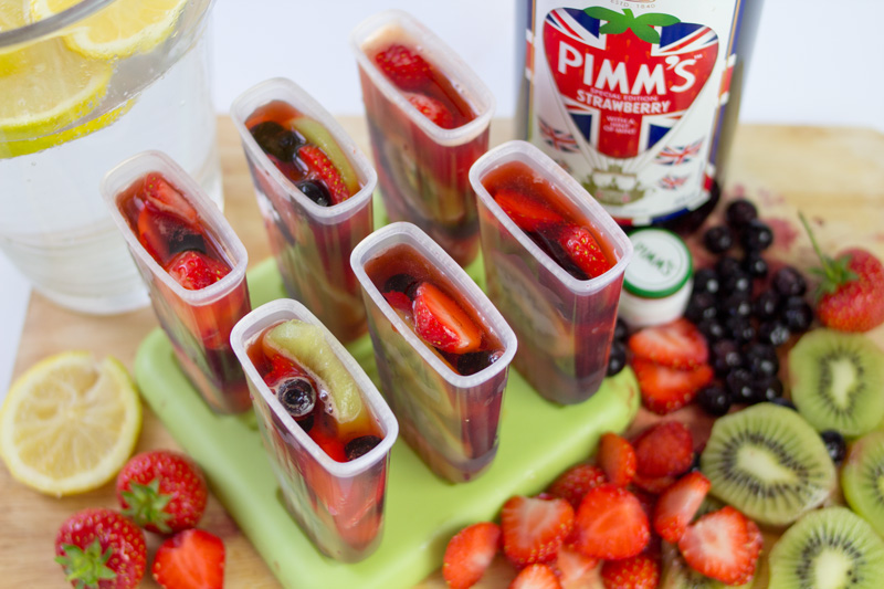 Classic Pimm's Cup, a must-have summer cocktail in England at cricket games, mixes Pimm's, lemon, and other fresh fruit. Turn this classic cocktail into a Pimm's Cup Boozy Popsicle for a fun twist on an adults-only dessert!