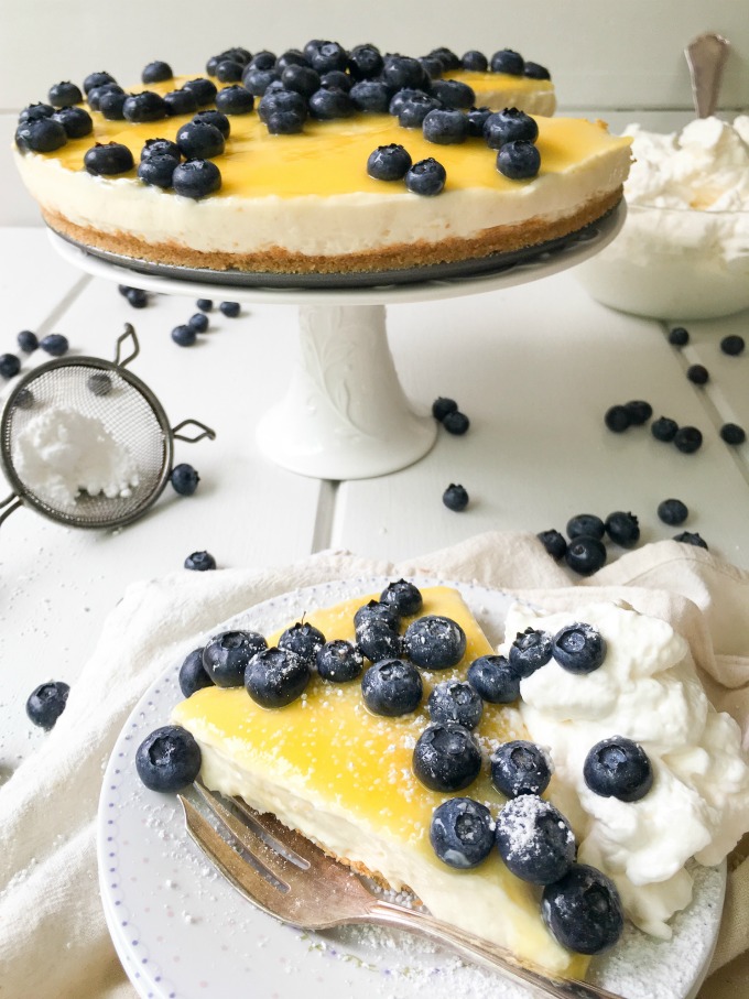 This No Bake Blueberry Lemon Cheesecake is a fresh, tangy and sweet dessert that does not require an oven to make! Enjoy fresh blueberries over sweet and tangy lemon curd with smooth & creamy cheesecake center and a graham cracker crust! Bring this delicious dessert to your next gathering. #SoFabFood