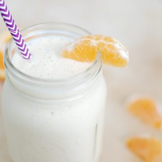 This Orange Creamsicle Smoothie recipe brings your favorite summer flavors into a healthy smoothie that packs in 10 grams of protein per serving!