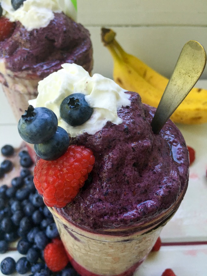 This Red, White, and Blue Frozen Fruit Smoothie has red raspberries, white bananas and blue blueberries as ingredient colors, creating a patriotic, Summer smoothie! It's healthy and delicious with naturally sweet honey and loads of vitamins and antioxidants from the fruit. Make this layered smoothie anytime of the day for a refreshing treat! #SoFabFood