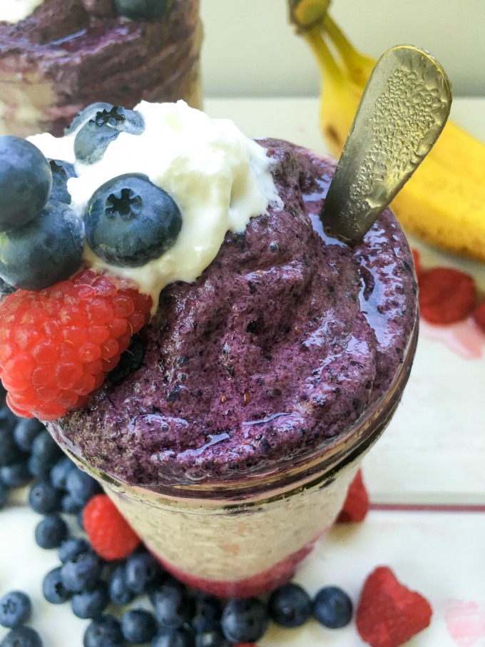 This Red, White, and Blue Frozen Fruit Smoothie has red raspberries, white bananas and blue blueberries as ingredient colors, creating a patriotic, Summer smoothie! It's healthy and delicious with naturally sweet honey and loads of vitamins and antioxidants from the fruit. Make this layered smoothie anytime of the day for a refreshing treat! #SoFabFood
