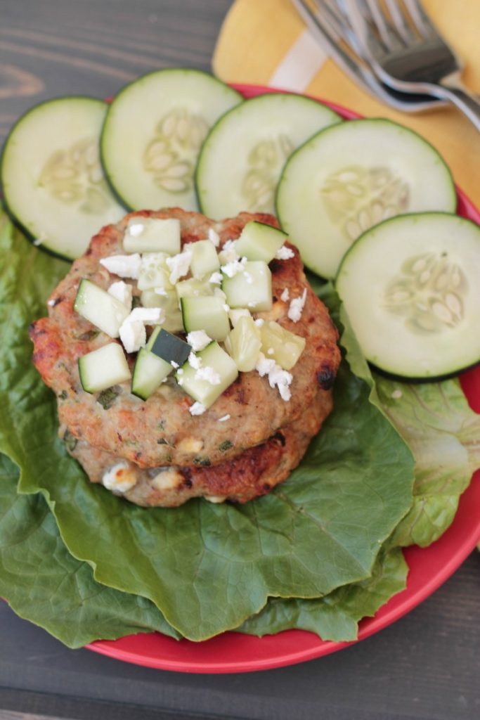 Holy flavor! These Greek turkey burgers are anything but bland! Even my turkey-hating hubby loved them! Omit the feta for a paleo and whole30 compliant burger that's lean and delicious!