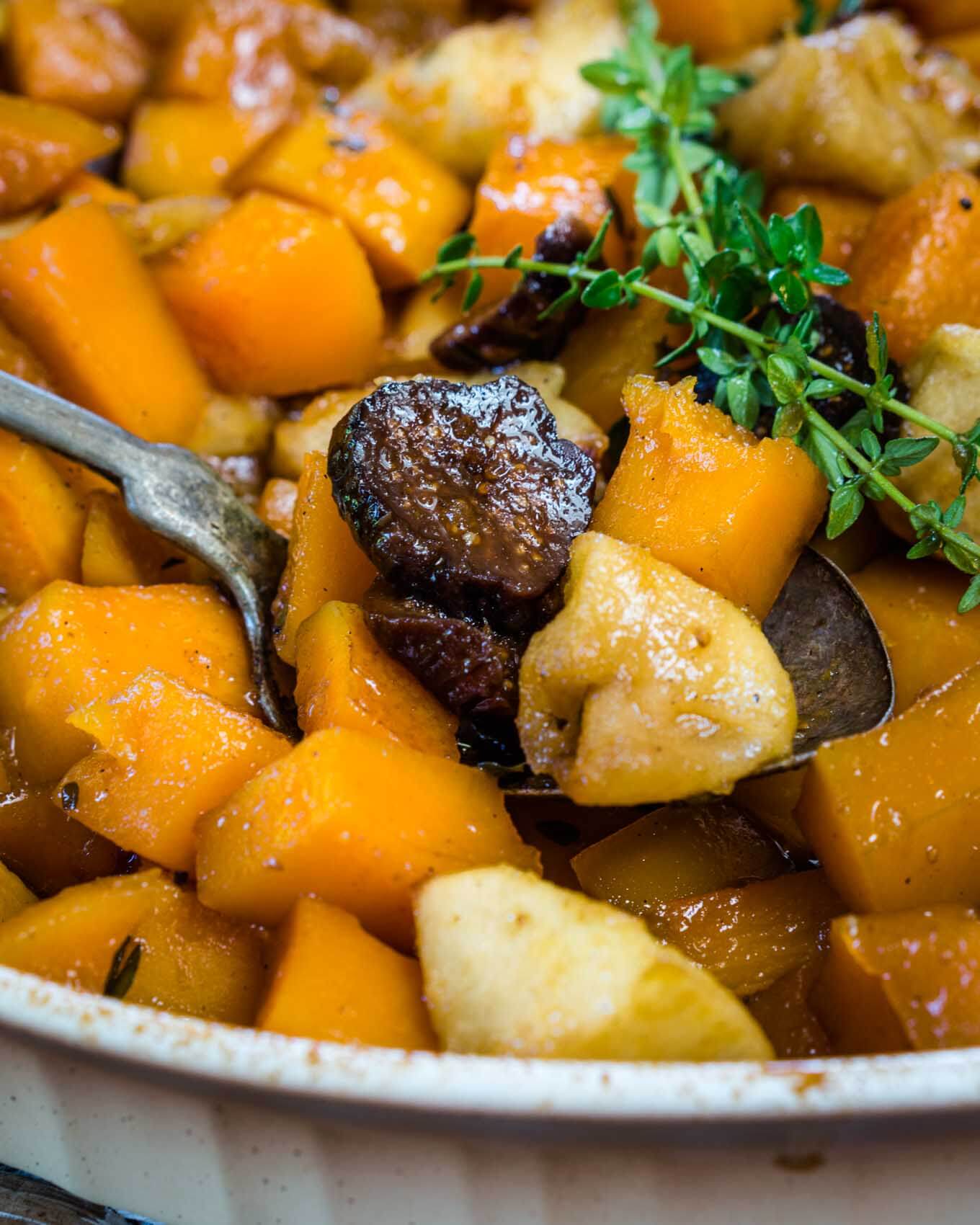 Baked Butternut Squash with Apples and Figs is warm, sweet, and buttery.  It tastes like it's loaded with fat and calories but neither one is welcomed in this dish. It's perfect for a casual dinner or dressed for the holidays because it's easy to put together and everyone will love it. | HostessAtHeart.com