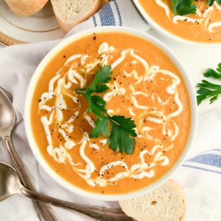 This 30-Minute Carrot Ginger Soup is pure comfort food full of all of your favorite fall flavors. This cheap healthy meal is the perfect quick weeknight dinner.
