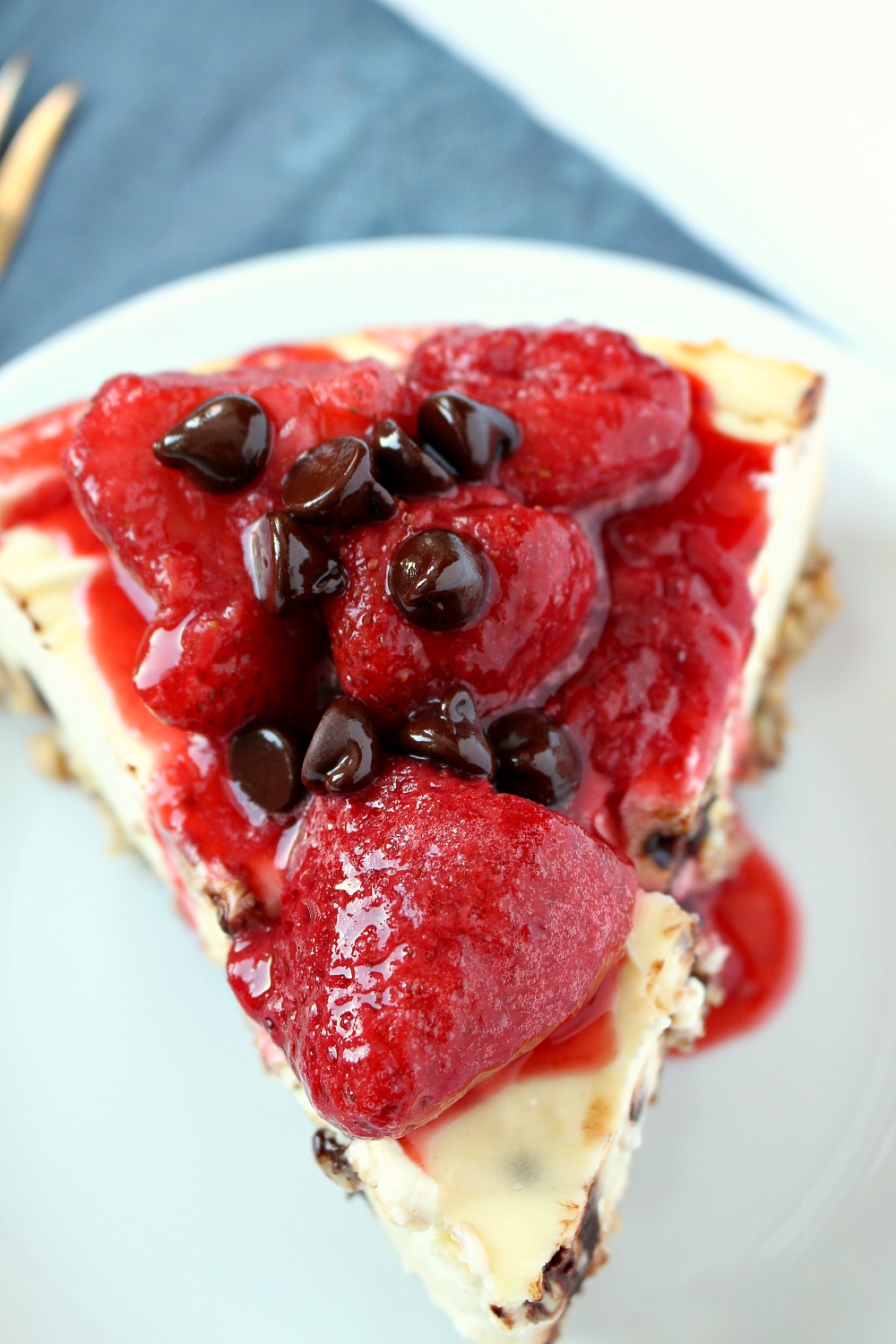 This Chocolate Chip Diabetic Cheesecake is a refined sugar free dessert that tastes just as amazing as traditional cheesecake. This gluten-free cheesecake is perfect with or without the strawberry topping.