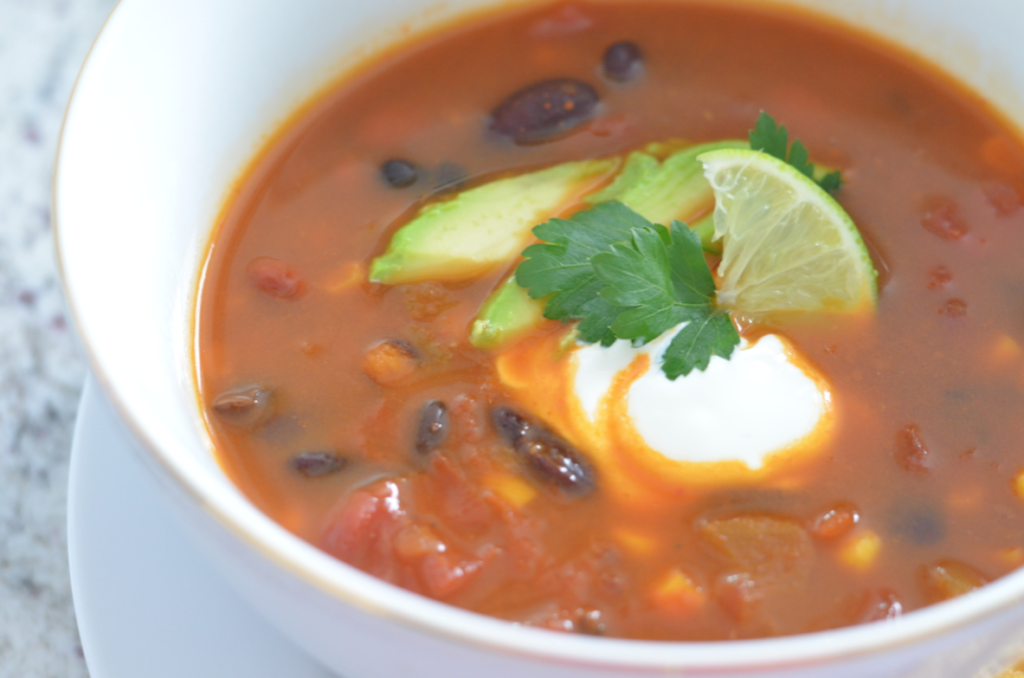 Turn traditional chili into a super healthy meal with a few simple swaps. Slow Cooker Vegetarian Chili is easy to make and it's the perfect weeknight meal.