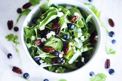 Satisfy your cravings with a delicious Caramelized Pecan Arugula Salad full of fresh blueberries, tangy goat cheese, and a drizzle of balsamic vinaigrette. The next time you want a simple, seasonal lunch, this is the salad for you.