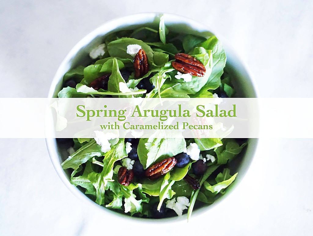 Satisfy your cravings with a delicious Caramelized Pecan Arugula Salad full of fresh blueberries, tangy goat cheese, and a drizzle of balsamic vinaigrette.