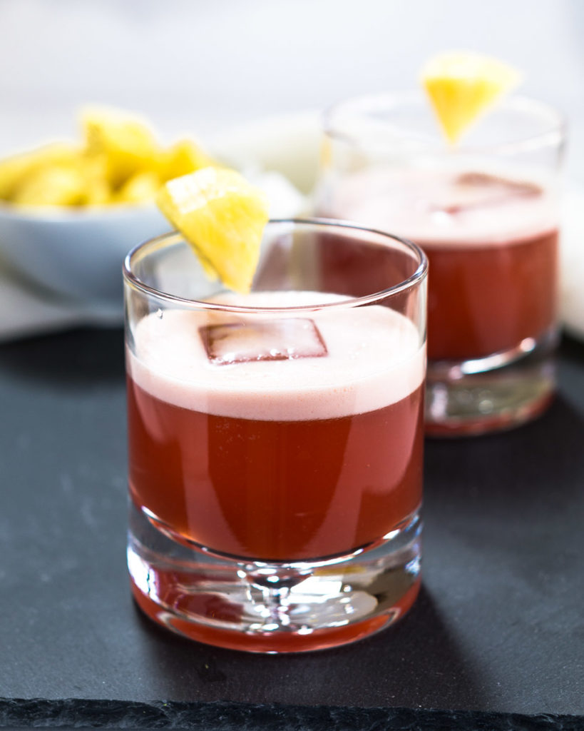 This Tropical Americano Cocktail is just as pretty as it is delicious. It's perfect for a quite after dinner drink or celebrating a special occasion. | HostessAtHeart.com