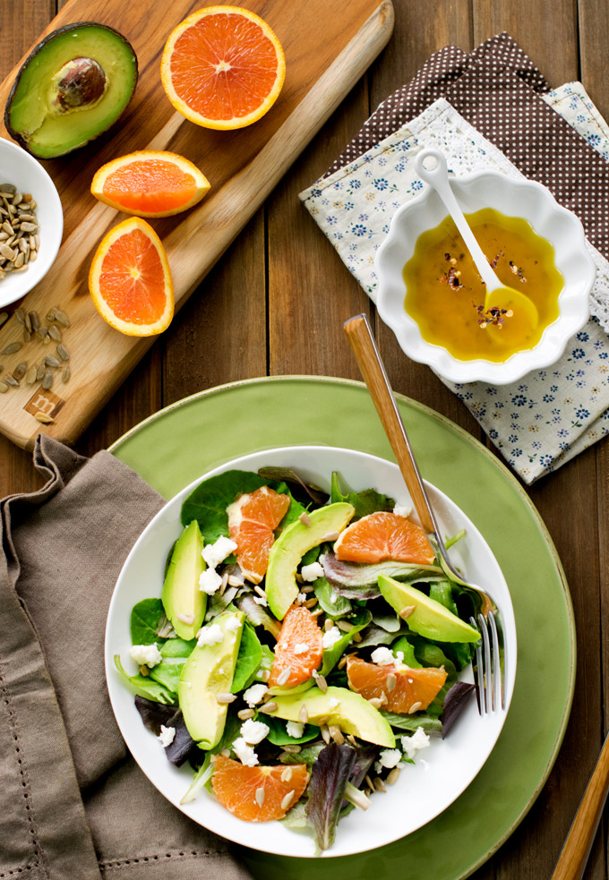 Enjoy a cheap healthy dinner when you make this farmers market fresh Citrus Avocado Salad with Turmeric Dressing. This summer salad is the perfect light lunch of dinner.