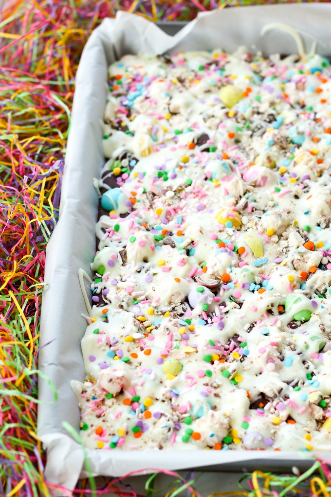 This Springtime Bunny Bark Dessert recipe is perfect for Easter and every day treat making. Semi-sweet chocolate, themed candy, white chocolate, and colorful sprinkles make up this a fun and easy dessert.