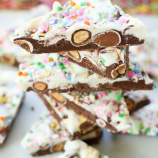 This Springtime Bunny Bark Dessert recipe is perfect for Easter and every day treat making. Semi-sweet chocolate, themed candy, white chocolate, and colorful sprinkles make up this a fun and easy dessert.