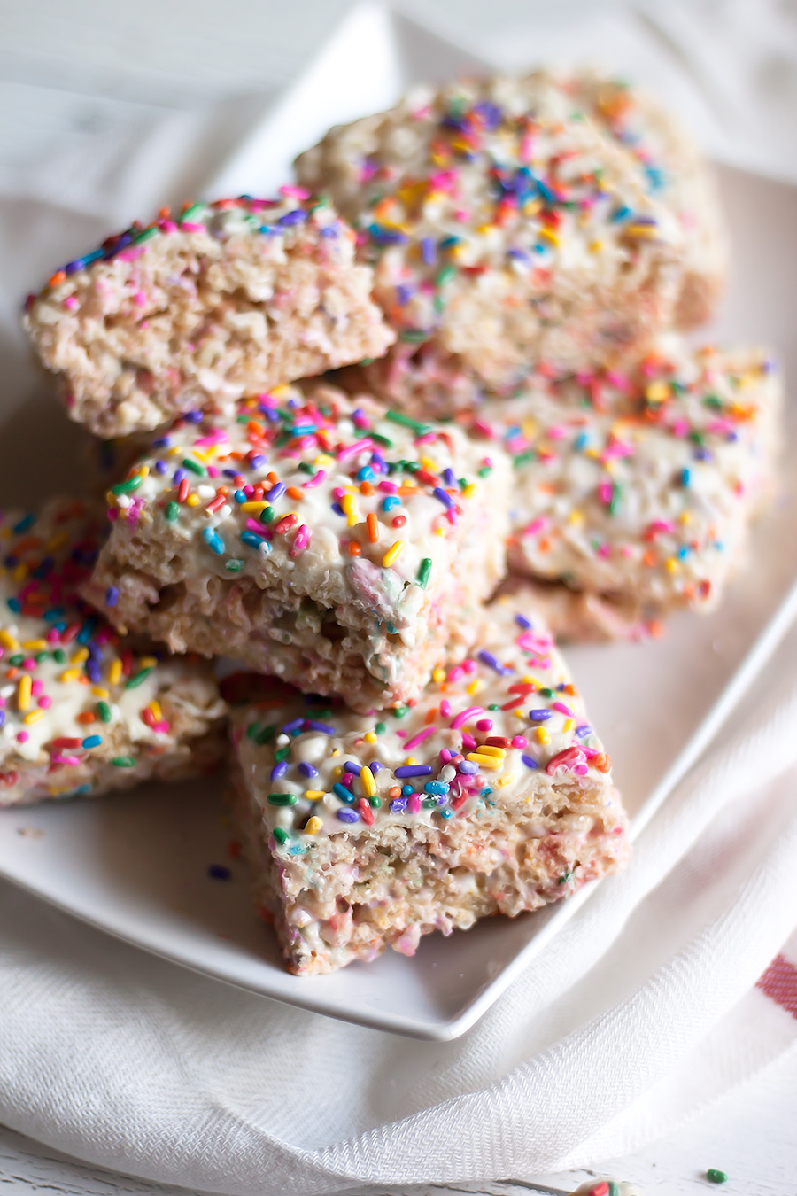 Sweet, crunchy White Chocolate Rice Cereal Treats elevate a classic family recipe by adding elegant white chocolate and spring-inspired sprinkles.