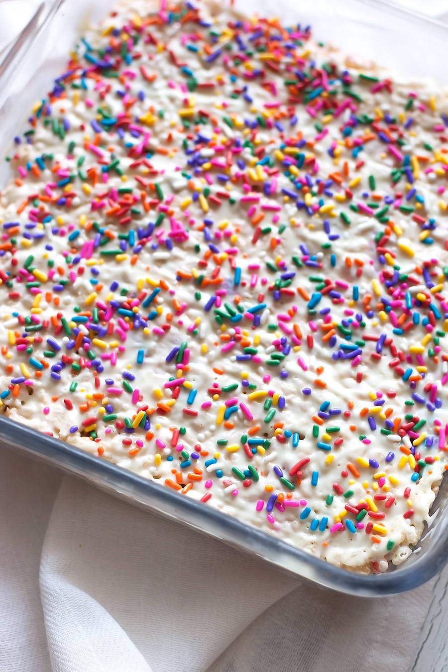 Sweet, crunchy White Chocolate Rice Cereal Treats elevate a classic family recipe by adding elegant white chocolate and spring-inspired sprinkles.