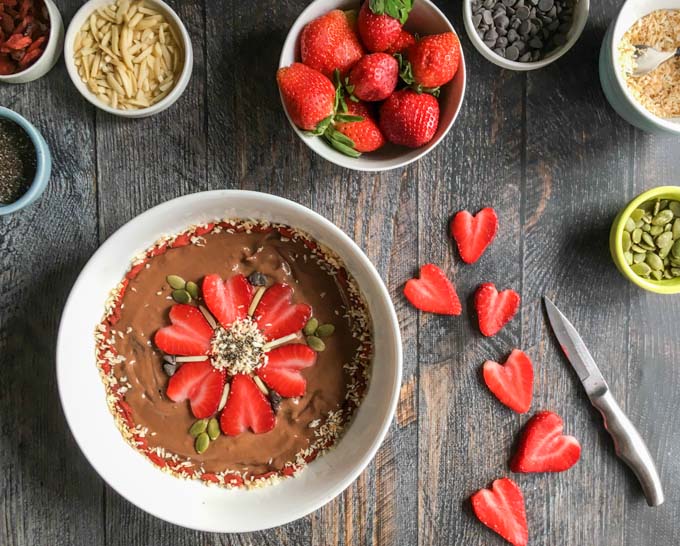 This healthy Chocolate Strawberry Smoothie Bowl made with creamy avocado, almond milk, and chocolate protein powder is blissfully rich, and good for you.