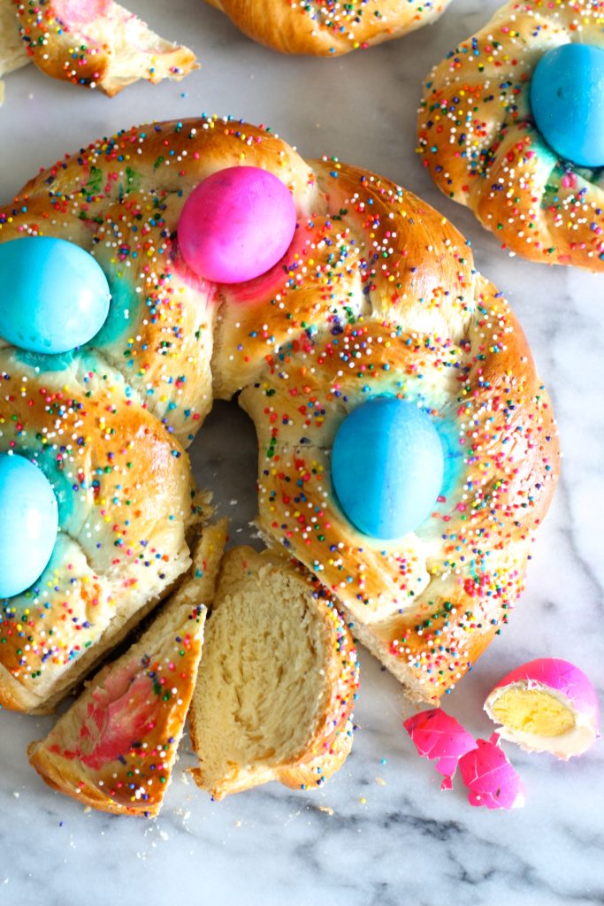 Your family will love to see this colorful Pane Di Pasqua, or Italian Easter Bread, on your holiday brunch table. It is a classic dish of slightly sweet, braided bread baskets with brightly-colored eggs woven in.