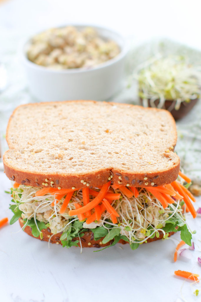 This protein-packed Chickpea Salad Sandwich recipe is made with a bounty of vegetables and is a great alternative to traditional lunchmeat sandwiches. A vegetarian delight that's simple to make and perfect for picnics!