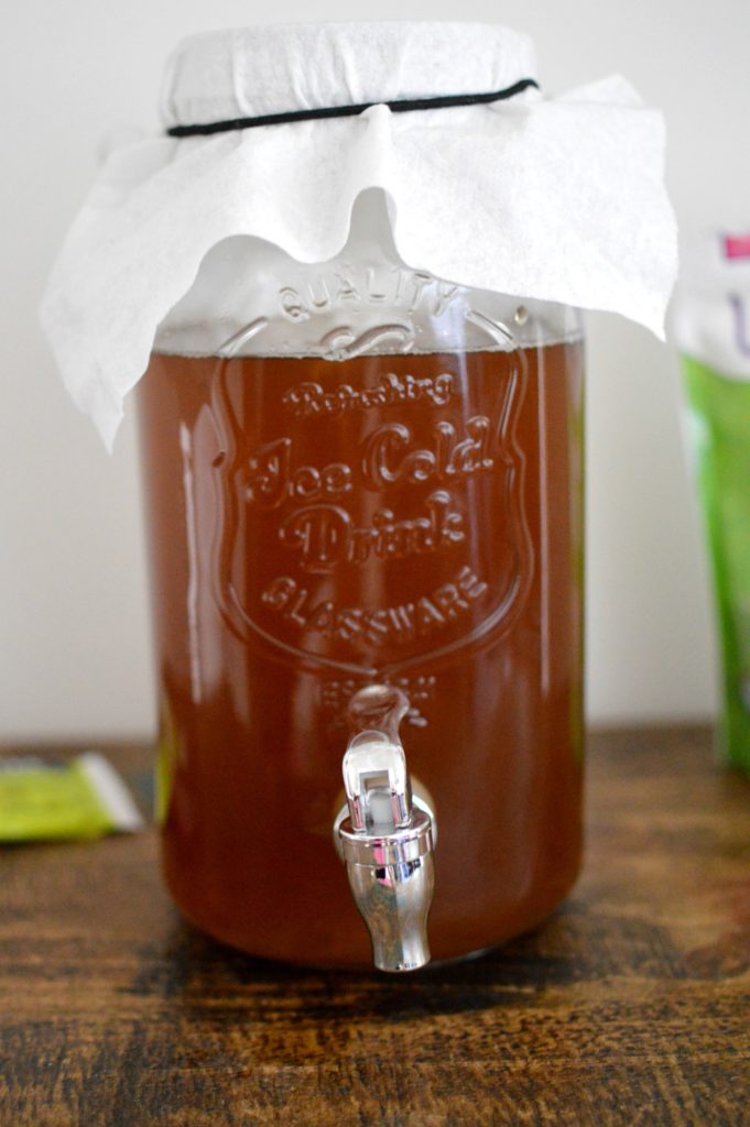 Learn how to make Kombucha Tea at home. You will fall in love with this healthy, fizzy drink with only four ingredients. This drink is packed with amazing health benefits and it's simple to make at home in five to seven days.