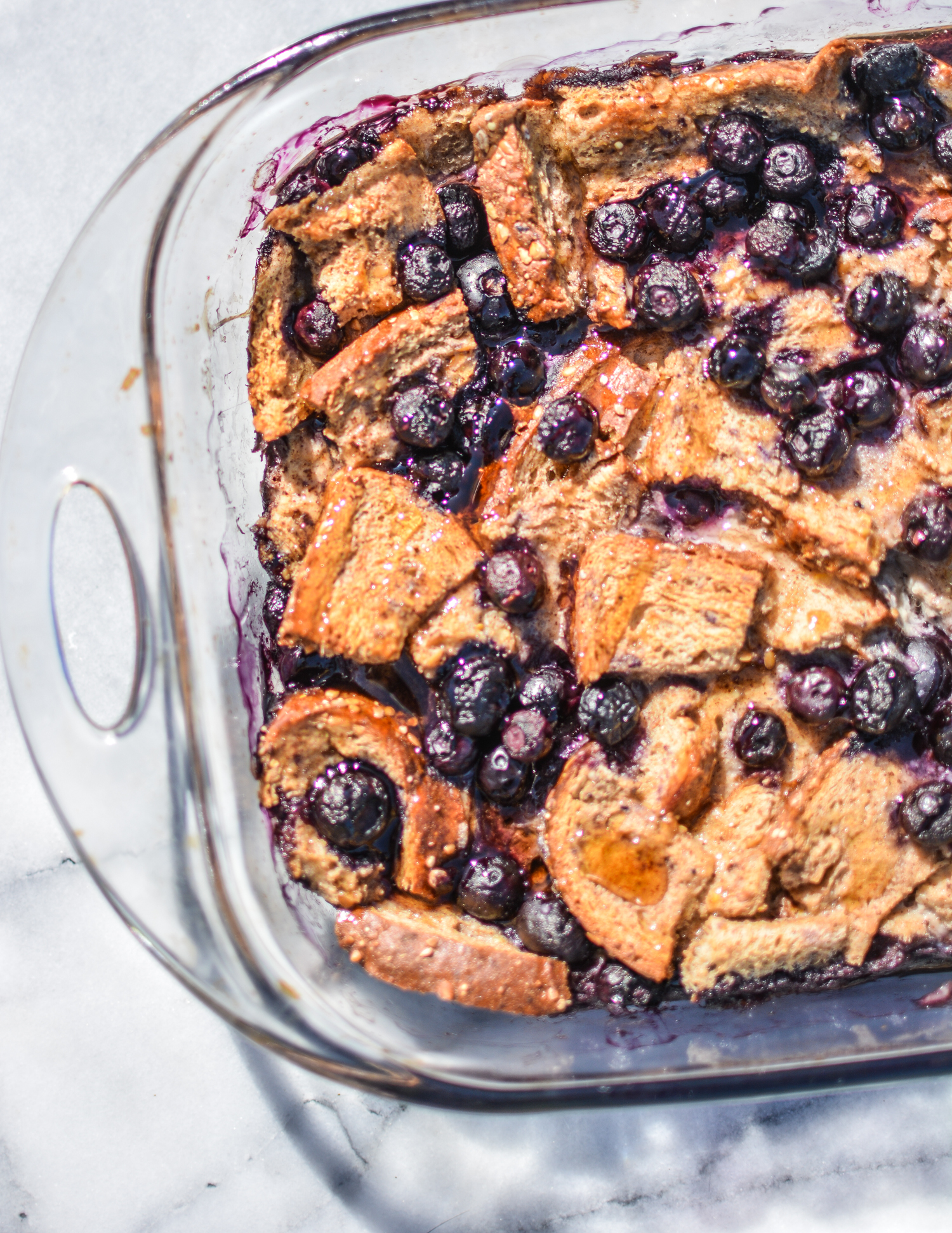 Keep things on the lighter side this Mother's Day with a skinny Blueberry French Toast Casserole made with egg whites, unsweetened almond milk, and berries.