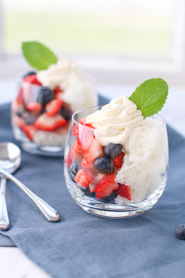 Celebrate summertime with these patriotic and super simple Strawberry Blueberry Trifle Cups! Angel food cake, cream cheese, strawberries, and blueberries make this the perfect red, white, and blue dessert for your holiday get togethers!