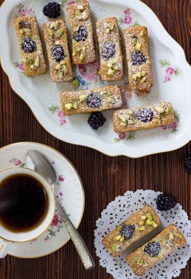 Financiers are traditional bite-sized French treats. Made with pistachio and almond flour, these French Financiers with Blackberries are an attractive dessert that's a melt-in-your mouth delight.