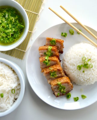 This Hong Kong Style Crispy Pork Belly is marinated in the fridge, tenderized, and then baked in the oven under a layer of coarse salt. Paired with simple white rice and an amazing ginger green onion sauce, this is an all-star dinner idea!