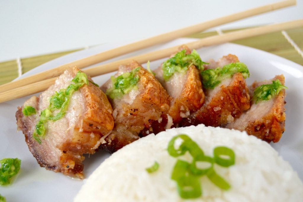 This Hong Kong Style Crispy Pork Belly is marinated in the fridge, tenderized, and then baked in the oven under a layer of coarse salt. Paired with simple white rice and an amazing ginger green onion sauce, this is an all-star dinner idea!