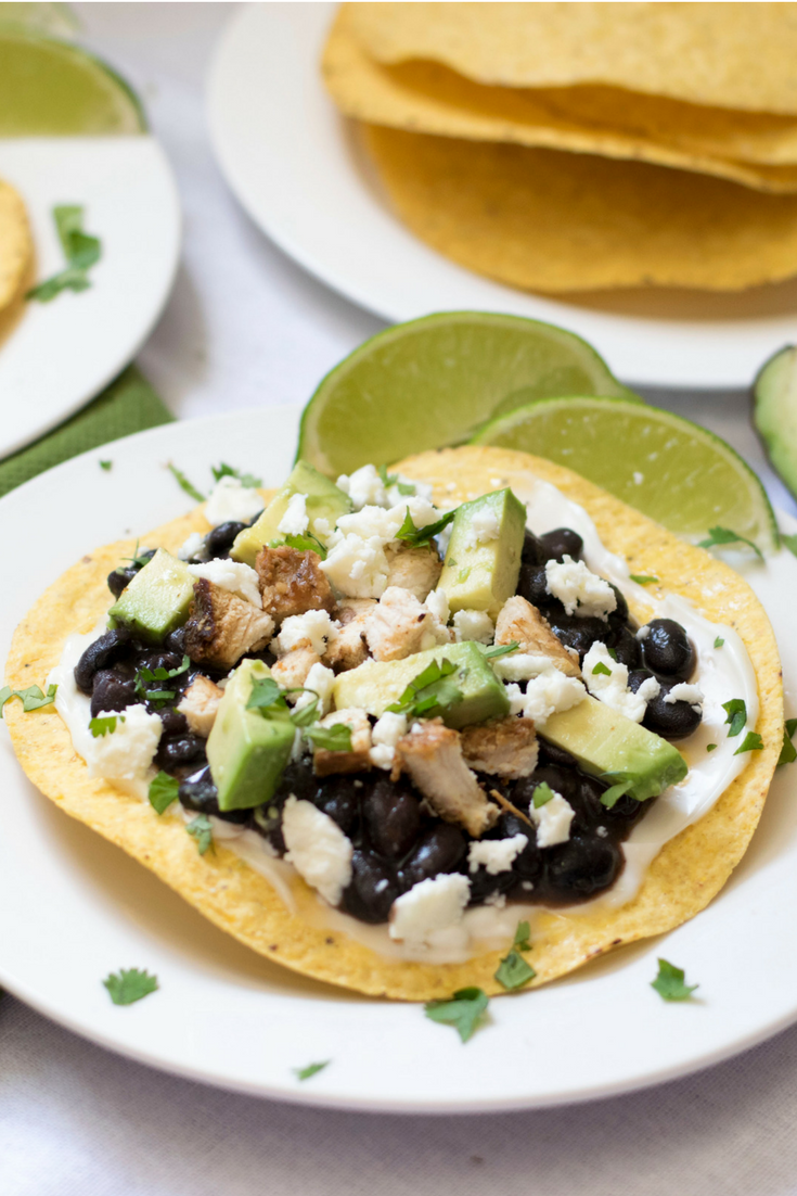 Use leftover chicken to whip up these Chicken Black Bean Tostadas Aztecas. This is a cheap healthy meal if you’re cooking for two, a great appetizer, or a simple 30-minute weeknight dinner.