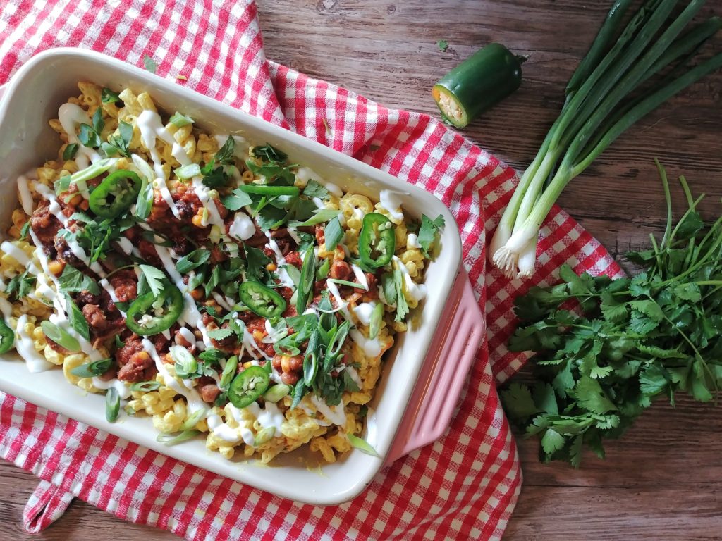 Ditch the not-so-healthy boxed dinner for this Vegan Chili Mac and Cheese recipe instead. Clean eating has never been simpler than this veggie and protein packed easy weeknight meal. A vegetarian dish that will fool the meat lovers.