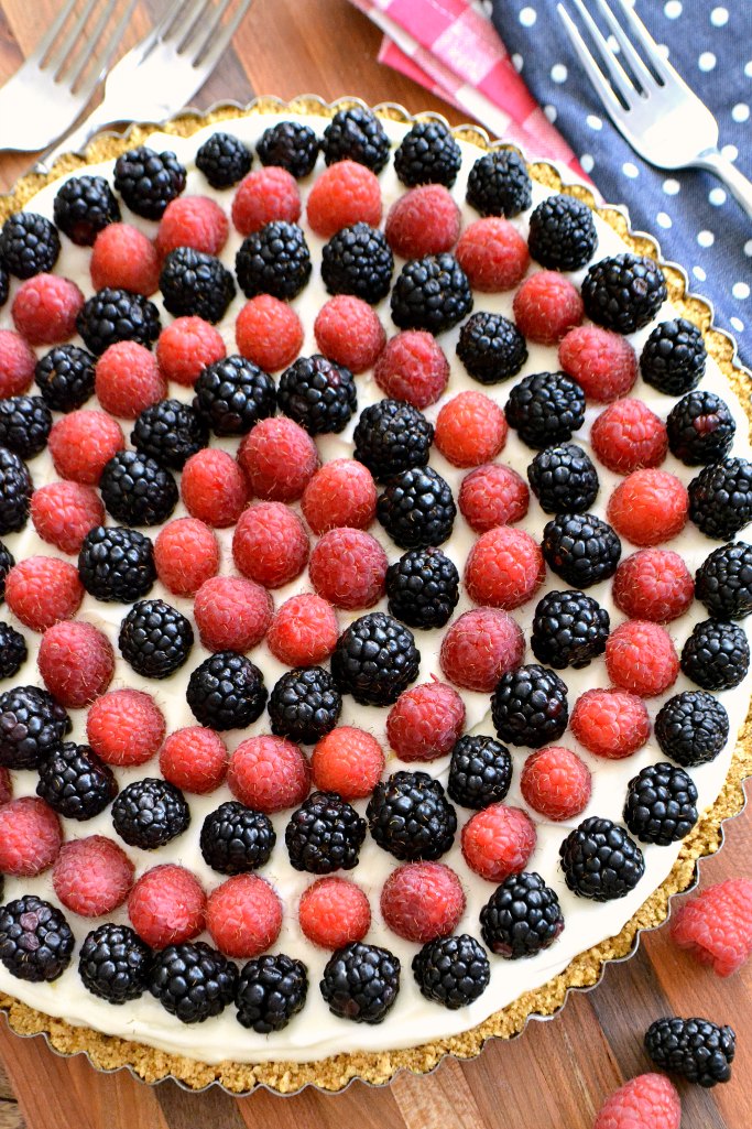 Celebrate your favorite patriotic holiday with this delicious Red, White, and Blue Cheesecake Tart. It’s an easy, yet decadent, no-bake recipe that your whole family will love!