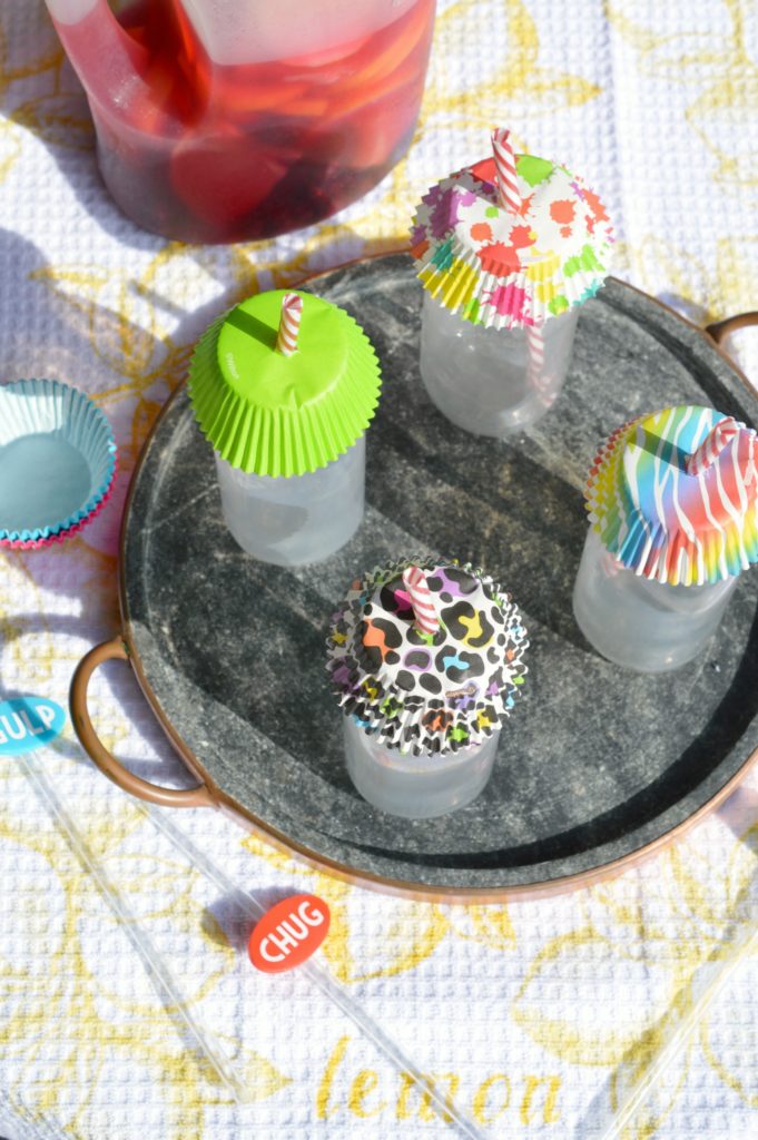 Tired of flying insects ruining your outdoor dining? Protect those refreshing drinks this summer when you use this economical and simple Cupcake Liner Drink Covers Hack. Not only practical, this tip is a fun way to brighten up the table!