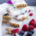 Granola Crunch Berry Yogurt Popsicles are the perfect summer treat! A protein packed sweet treat you can make in minutes and let the freezer do the rest.