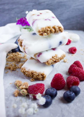 Granola Crunch Berry Yogurt Popsicles are the perfect summer treat! A protein packed sweet treat you can make in minutes and let the freezer do the rest.