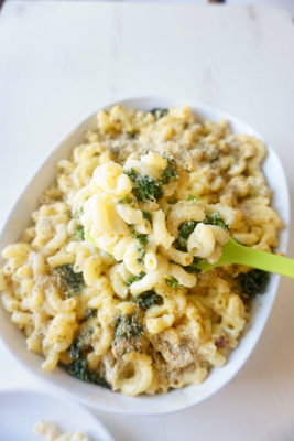 This Roasted Kale Cauliflower Baked Mac and Cheese is a cheesy concoction that's simple to make and a super way to get your kids to eat their vegetables!