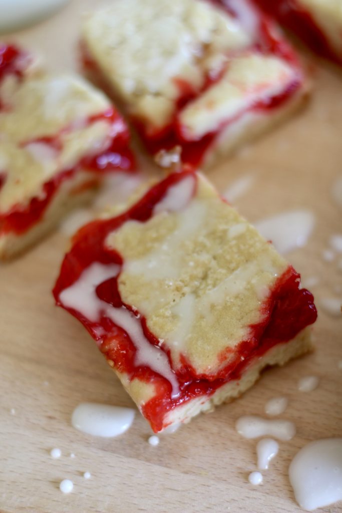 This Easy Cherry Pie Bars recipe calls for a buttery crust, a sweet cherry filling, and more delicious crust. These quick bars are the perfect dessert for your next summer BBQ!