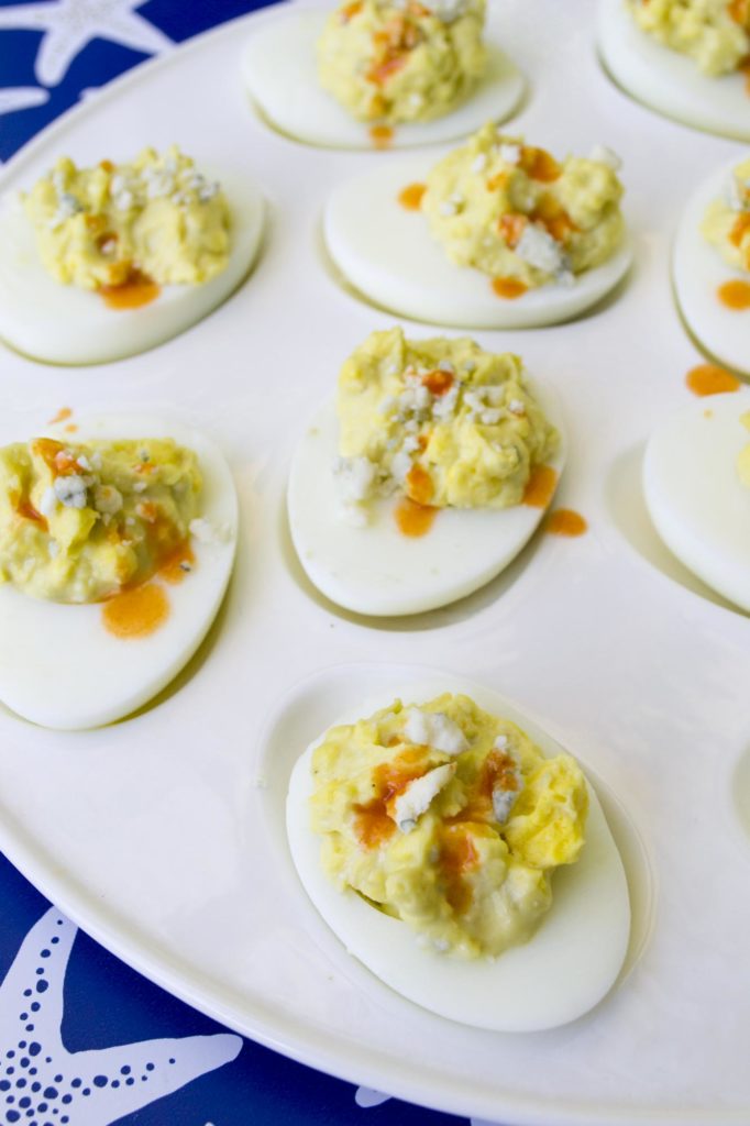 Show your patriotic pride at your next outdoor gathering when you make these simple and unique Red, White, and Bleu Deviled Eggs. Adding savory mix ins to traditional deviled eggs makes them even more special for the holidays!