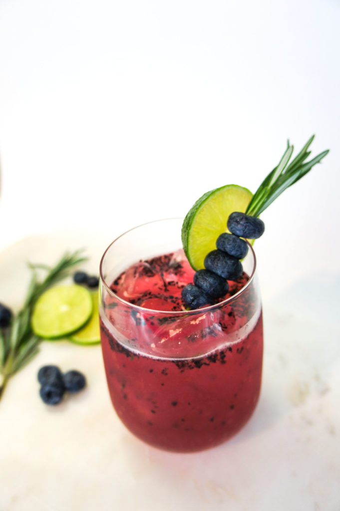 If you're looking to rock those health goals, get bikini ready, or you're simply not too fond of alcohol, this fabulously refreshing Blueberry Rosemary Mocktail Spritzer recipe is for you!