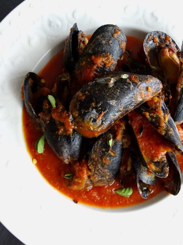 Turn up the heat this summer with this Spicy Summer Mussels recipe! It's a family favorite that's quick and easy to make for all of your summer gatherings!