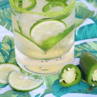 This Jalapeño Limeade Cocktail recipe is equal parts sweet, sour, and spicy - a triple threat in the world of craft cocktails! This lime-vodka based cocktail uses fresh fruit and veggies to make it a unique taste explosion!
