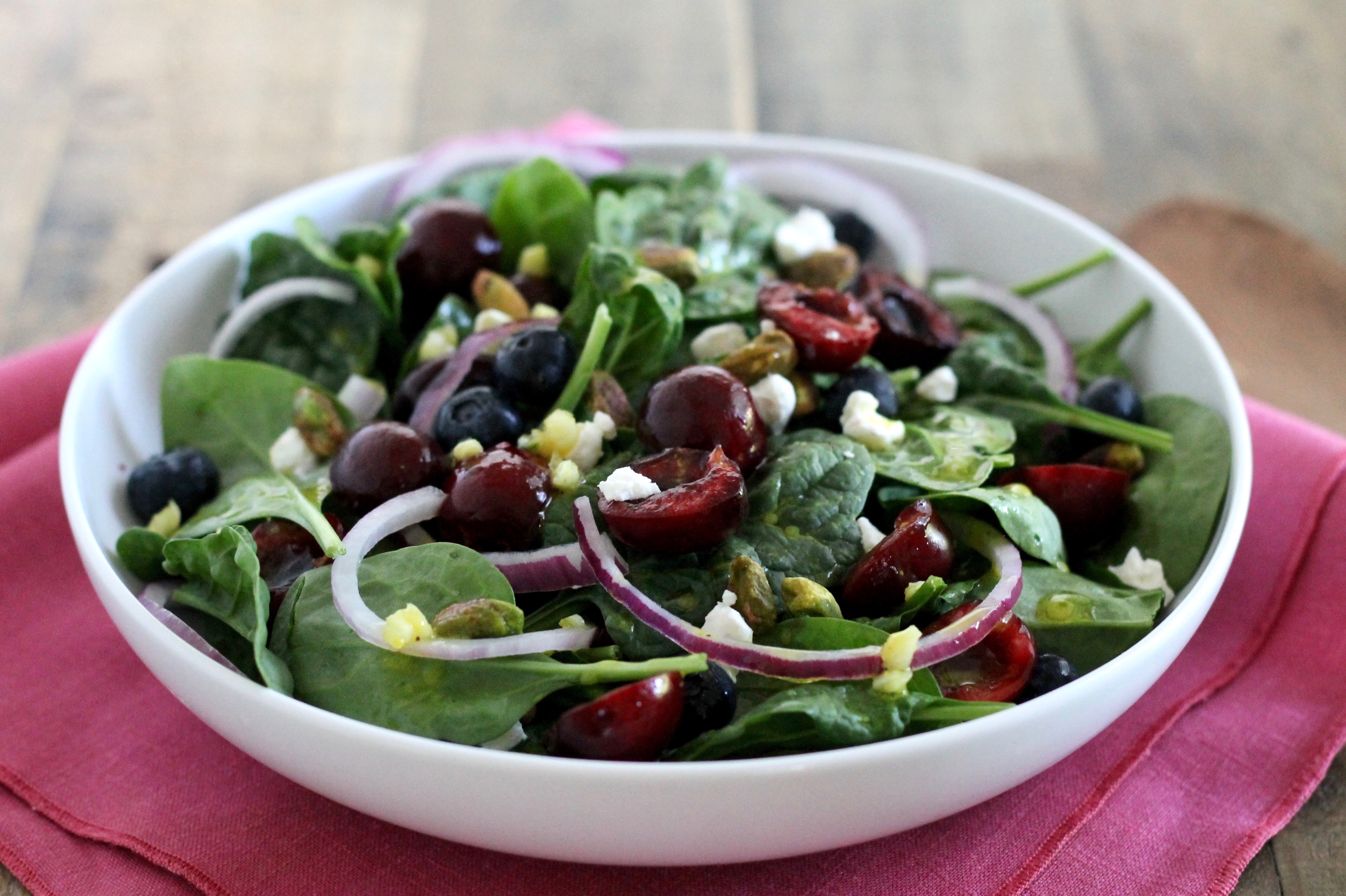 Spinach Salad with Cherries, Goat Cheese and Pistachios. A light and delicious summer salad recipe!