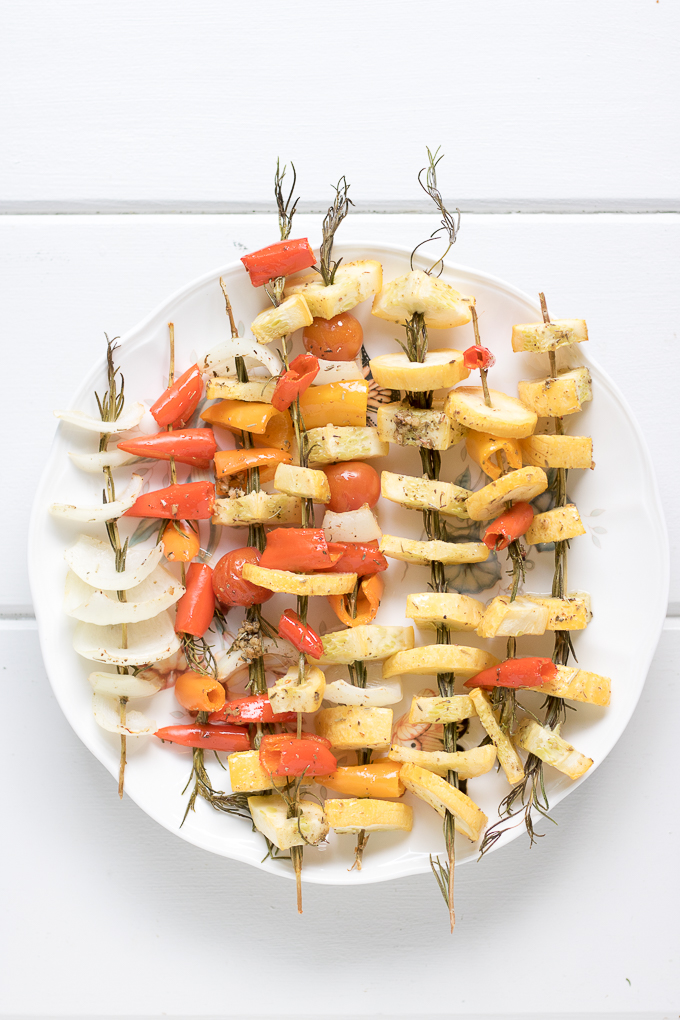 These delicious Baked Rosemary Vegetable Skewers made with garden fresh summer vegetables are the perfect way for you to enjoy seasonal produce. You can bring them to any summer gathering or enjoy them as a unique way to serve vegetables at dinner.