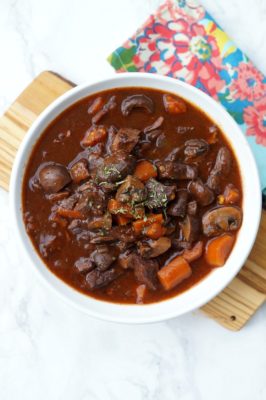 Your family will love this Instant Pot Beef Bourguignon recipe full of flavor and made in less than an hour. It's a modern take on Julia Child's classic!