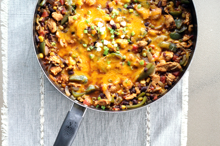 What's not to love about this 30-Minute Chicken Fajita Fiesta Skillet recipe? Tender chicken combined with peppers, onions, black beans, corn, and Mexican rice. One skillet, minimal mess, and full of bold flavors!